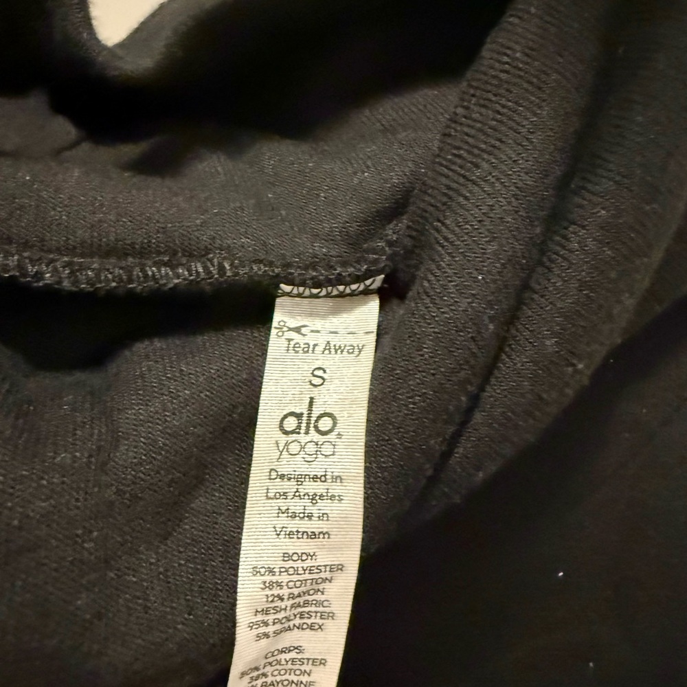 ALO Yoga Black Turtle Neck Sweater with sheer cutouts.